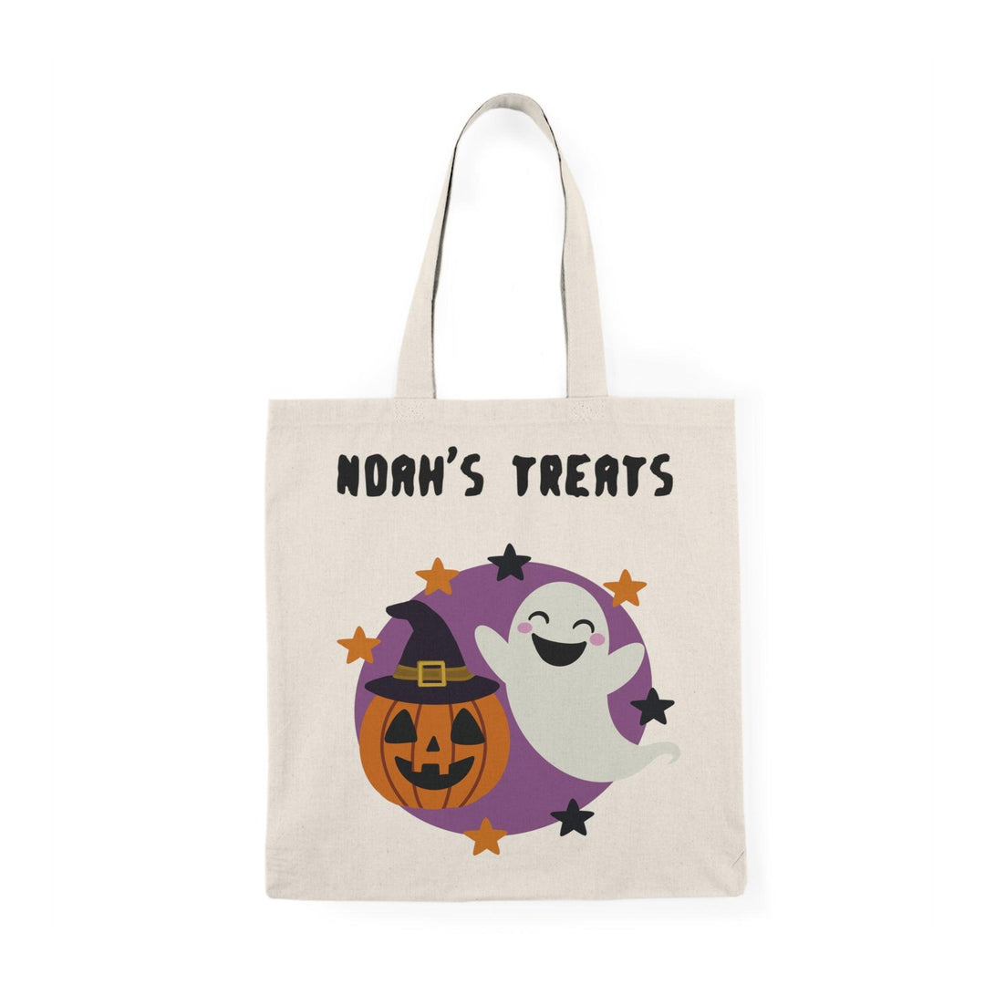 A natural tote bag displaying a whimsical design featuring a friendly ghost and Halloween elements, along with the text 'Oliver’s Treats.' This playful design is perfect for Halloween festivities, making it a fun accessory for trick-or-treating or festive gatherings