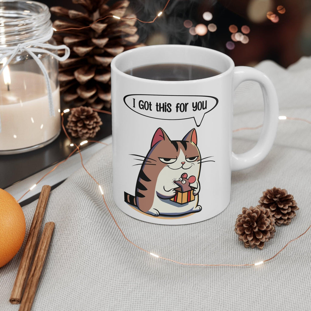 Adorable white ceramic mug featuring a cute cat holding a fish with the text 'I Got This for You,' making it a sweet and playful gift for cat lovers
