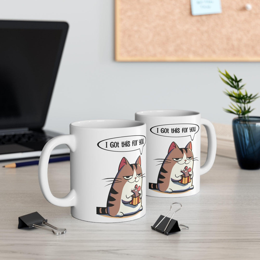 Adorable white ceramic mug featuring a cute cat holding a fish with the text 'I Got This for You,' making it a sweet and playful gift for cat lovers