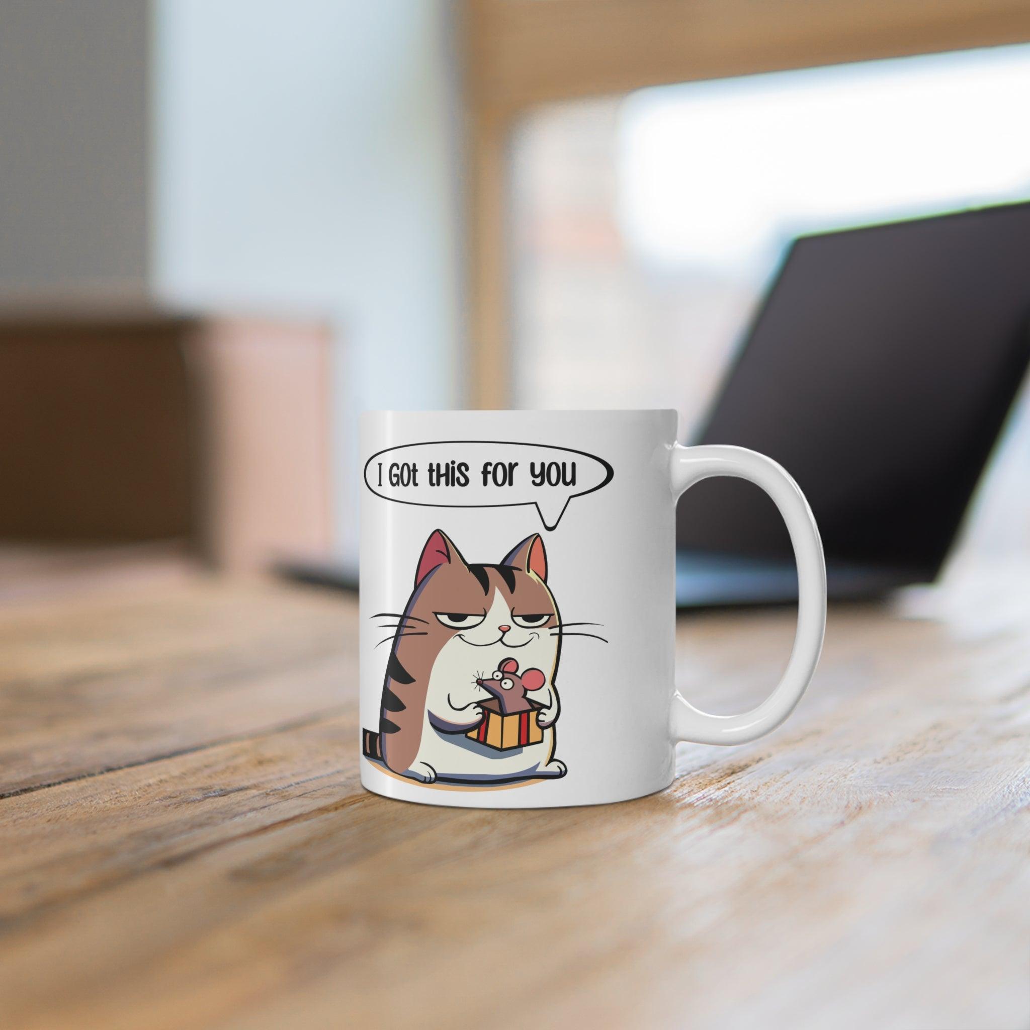 Adorable white ceramic mug featuring a cute cat holding a fish with the text 'I Got This for You,' making it a sweet and playful gift for cat lovers