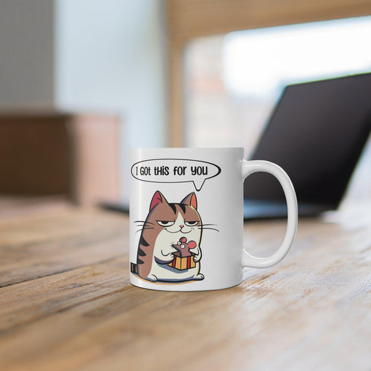 Adorable white ceramic mug featuring a cute cat holding a fish with the text 'I Got This for You,' making it a sweet and playful gift for cat lovers