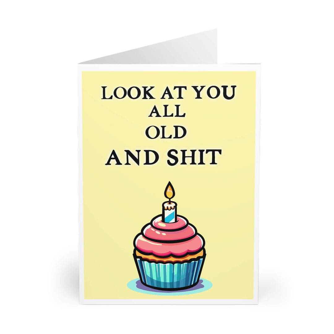 Humorous birthday card featuring a colorful cupcake with a single candle, paired with the cheeky phrase 'Look at You All Old and Shit.' Perfect for sending a fun, lighthearted birthday message - Baby Keo.