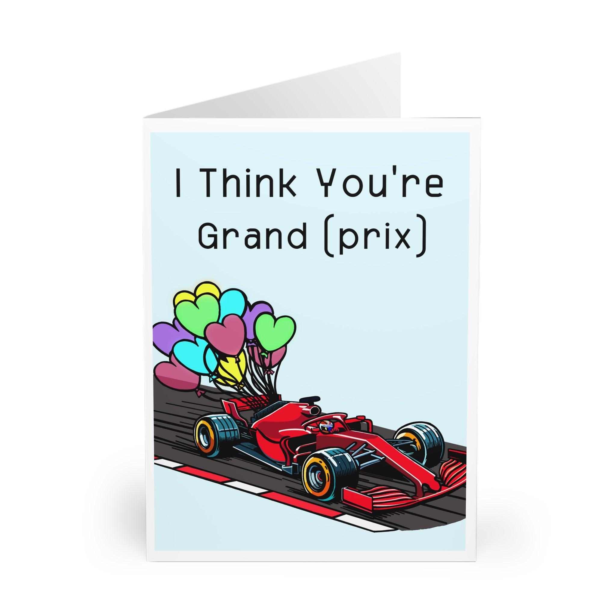 Playful greeting card featuring a Formula 1 race car and the phrase 'I Think You’re Grand (Prix).' Ideal for racing fans or as a fun compliment with a twist - Baby Keo.