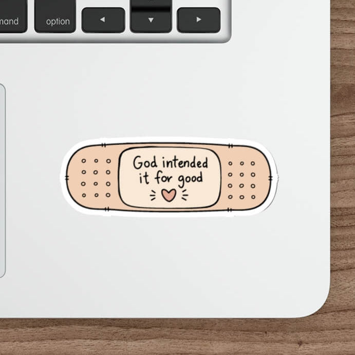 Cute Genesis 50:20 Christian sticker designed as a beige bandage featuring the words God Intended It For Good with a small heart.