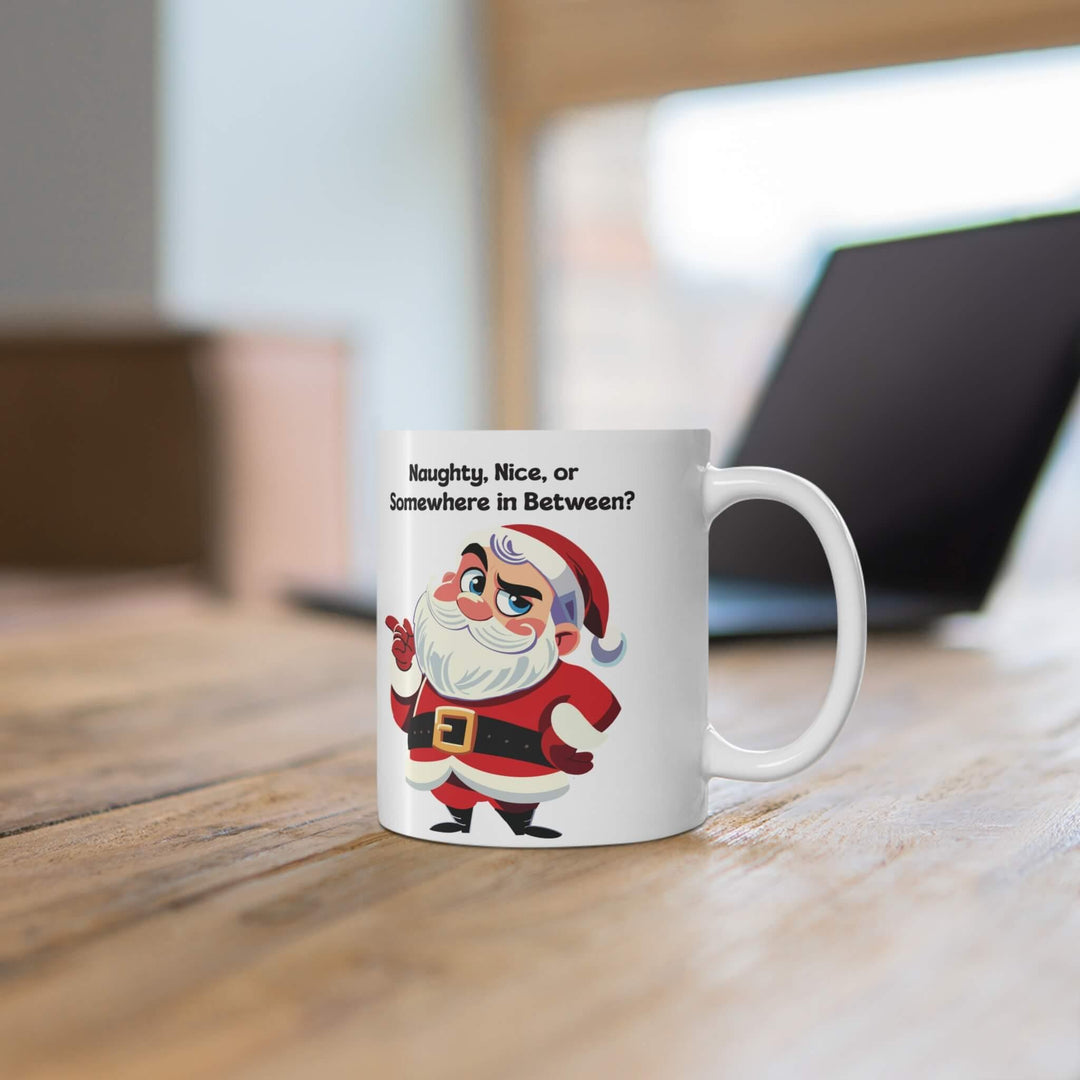 Funny Christmas mug featuring a sassy Santa and the phrase 'Naughty, Nice, or Somewhere in Between?' Perfect for holiday coffee or hot chocolate, this ceramic mug brings humor to festive mornings. Available in 11oz and 15oz sizes