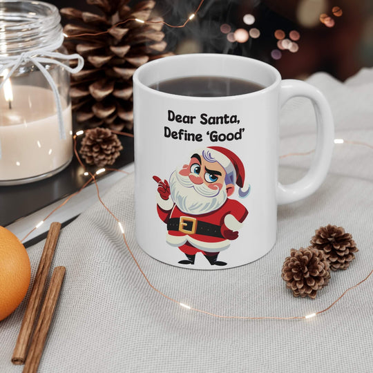 Funny Christmas mug featuring a cheeky Santa with the phrase 'Dear Santa, Define Good,' perfect for holiday coffee or hot chocolate. Available in 11oz and 15oz sizes, ideal for adding a humorous twist to Christmas decor.