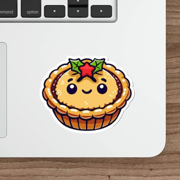 Cute waterproof mince pie sticker with a smiling face and holly, perfect for decorating water bottles, laptops, and skateboards during the holiday season. Durable and weatherproof, this festive sticker brings a cozy Christmas touch to any surface