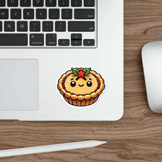 Cute waterproof mince pie sticker with a smiling face and holly, perfect for decorating water bottles, laptops, and skateboards during the holiday season. Durable and weatherproof, this festive sticker brings a cozy Christmas touch to any surface