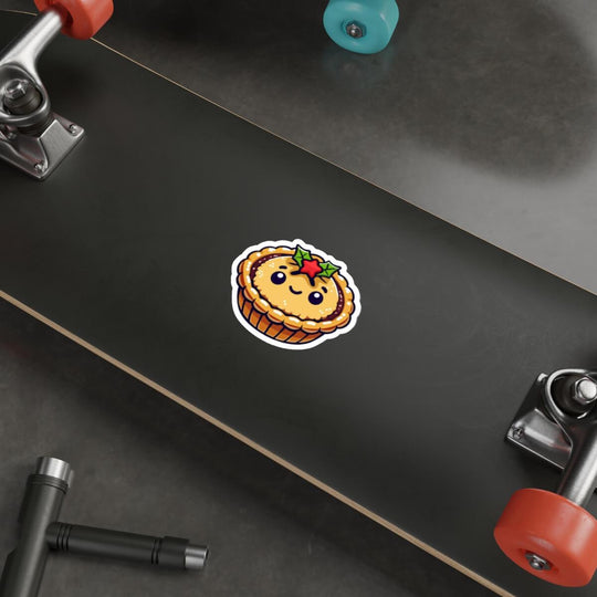 Cute waterproof mince pie sticker with a smiling face and holly, perfect for decorating water bottles, laptops, and skateboards during the holiday season. Durable and weatherproof, this festive sticker brings a cozy Christmas touch to any surface