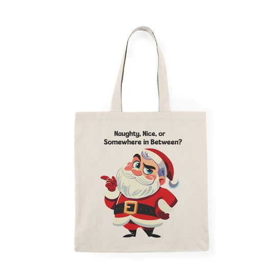 Cheeky Santa tote bag with the phrase 'Naughty, Nice, or Somewhere in Between?' Perfect for holiday shopping or as a festive accessory. Made from 100% recycled cotton, measuring 40 x 38 cm (15.7 x 15 inches) and 130-135 gsm thickness, this eco-friendly tote is durable and adds a playful touch to the season.