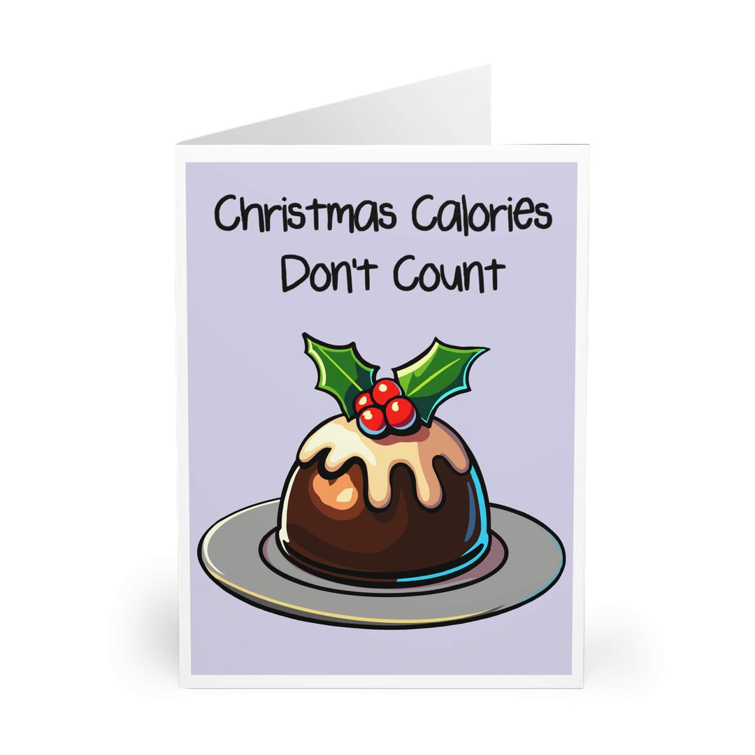 Funny Christmas card featuring a festive pudding with holly and the phrase 'Christmas Calories Don’t Count.' Perfect for adding humor to holiday greetings. Available in A5, 5x7, and A6 sizes