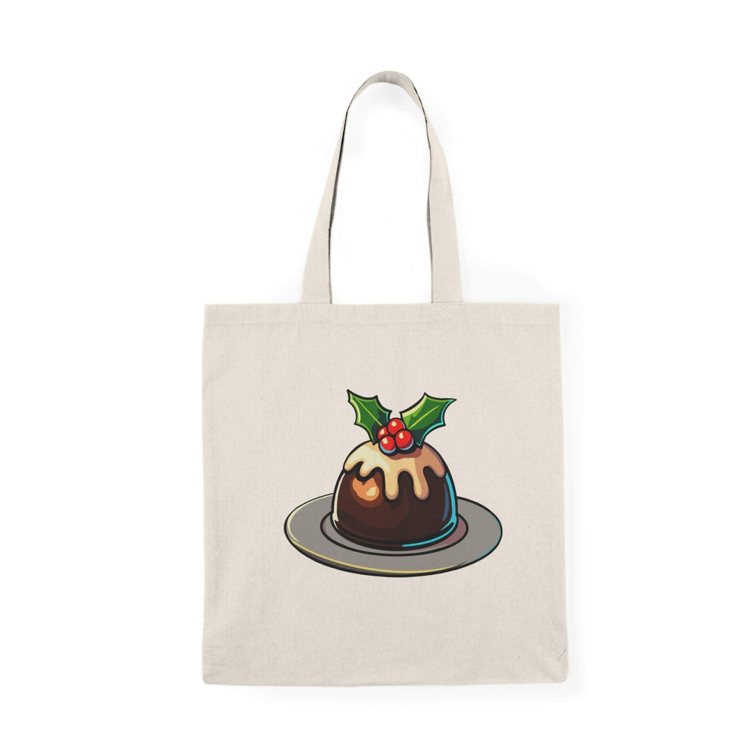 Festive Christmas pudding tote bag featuring a traditional pudding with holly and icing. Made from 100% recycled cotton, perfect for holiday shopping, gift-carrying, and adding seasonal charm to daily errands