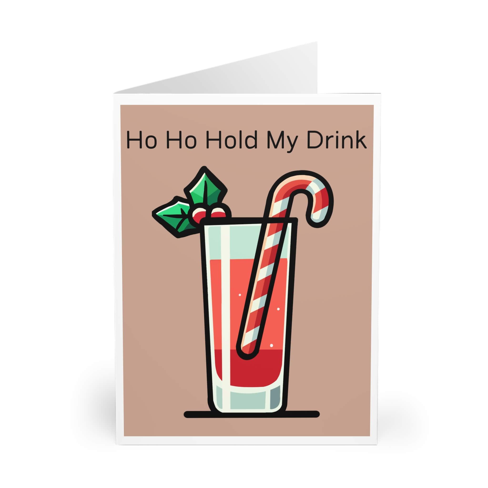 Funny 'Ho Ho Hold My Drink' Christmas card with festive drink, candy cane, and holly, perfect for holiday greetings