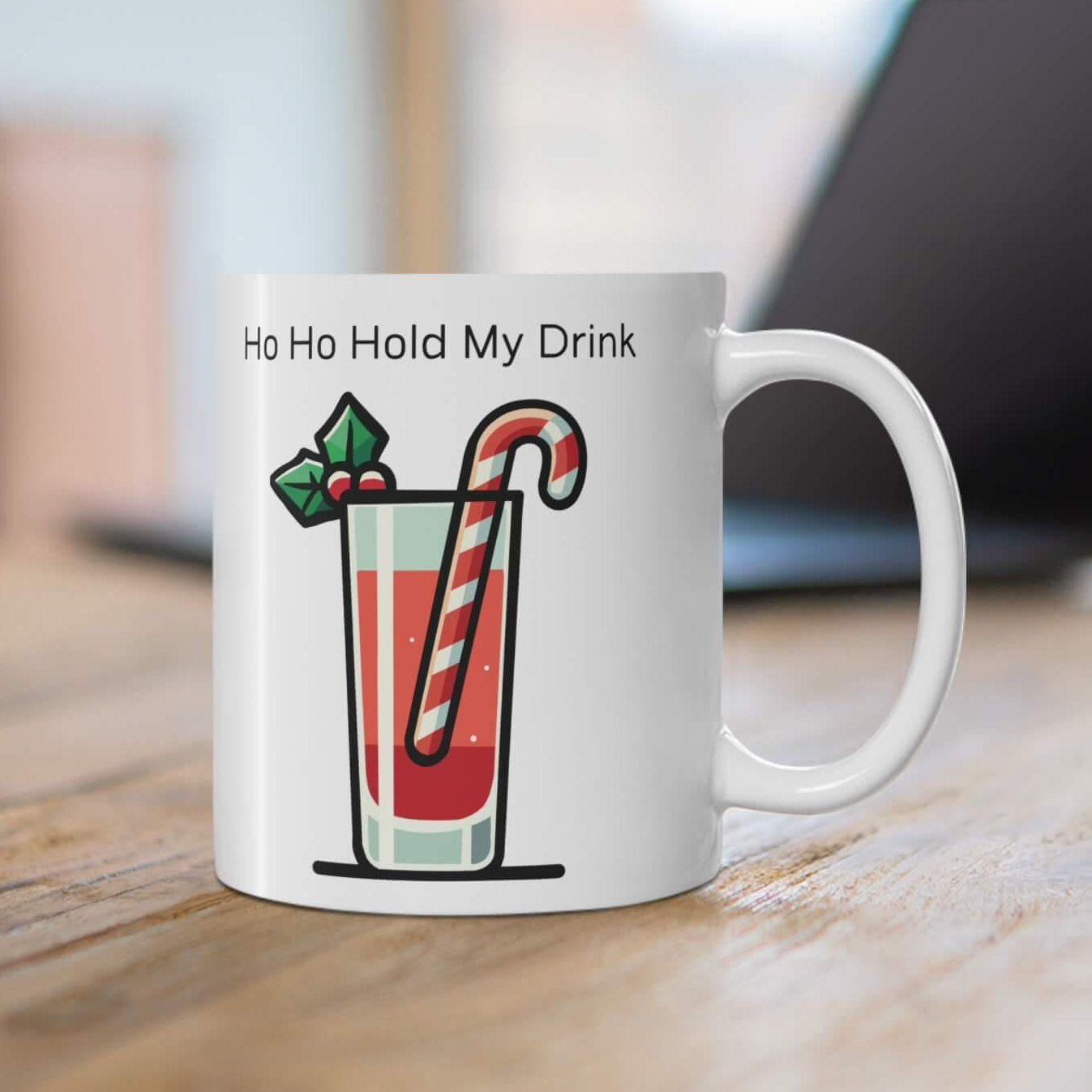 Ho Ho Hold My Drink’ 11oz ceramic Christmas cocktail mug with festive drink, candy cane stirrer, and holly, perfect for holiday sips