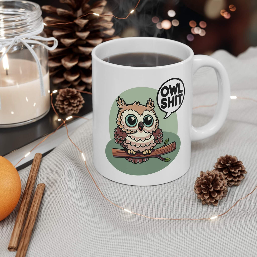 Playful 'Owl Shit' ceramic mug with a glossy finish, featuring a cute owl on a branch. Perfect for adding a touch of humor to your morning coffee or tea
