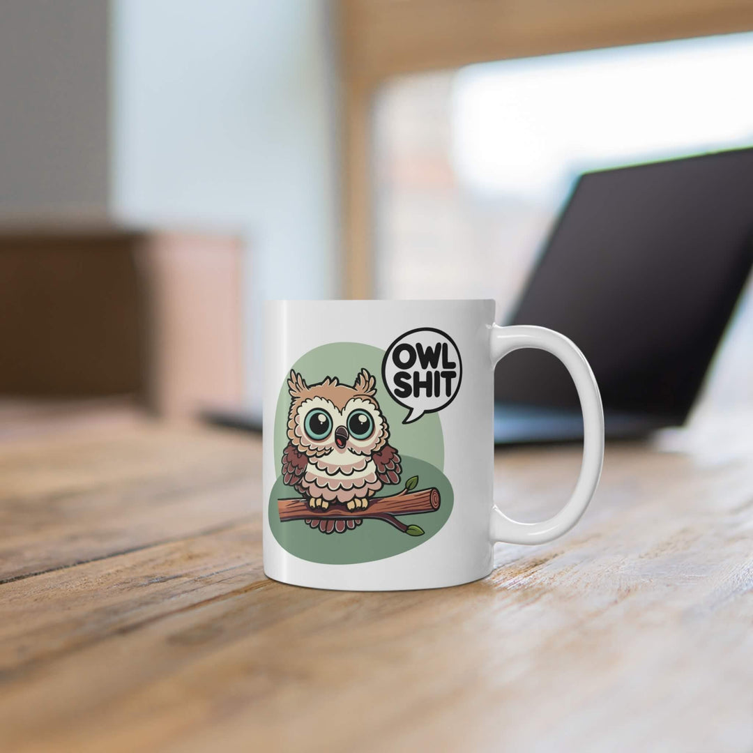 Playful 'Owl Shit' ceramic mug with a glossy finish, featuring a cute owl on a branch. Perfect for adding a touch of humor to your morning coffee or tea