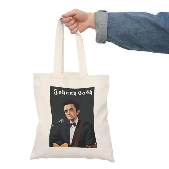 Tote bag featuring an artistic portrayal of Johnny Cash with his guitar, perfect for fans of the legendary musician