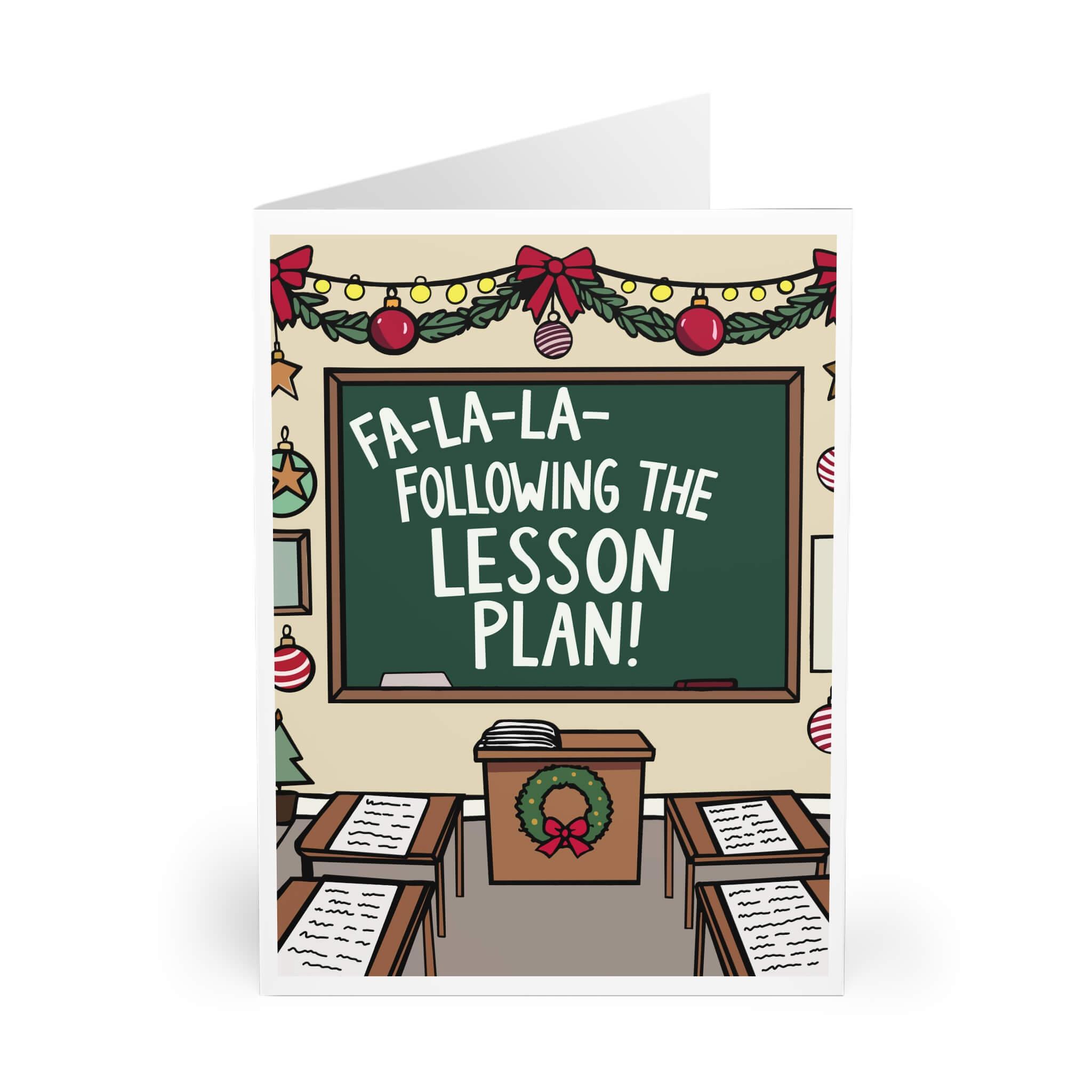 Festive Christmas card featuring a classroom scene with a blackboard that reads 'Fa-la-la—Following the Lesson Plan!' decorated with holiday garlands and ornaments.