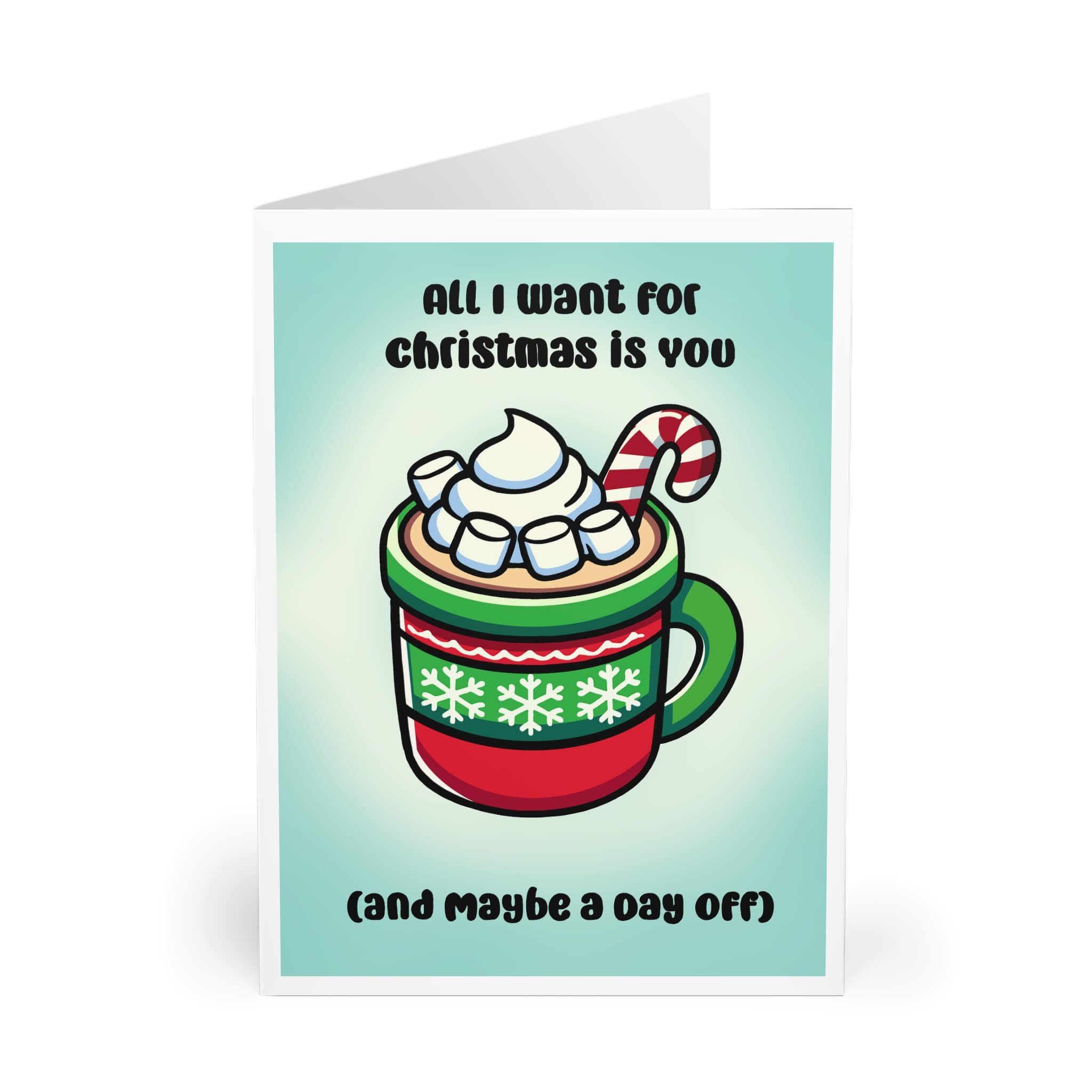 A festive Christmas greeting card featuring an illustration of a cozy mug of hot chocolate, topped with whipped cream, marshmallows, and a candy cane, surrounded by the text "All I want for Christmas is you (and maybe a day off)" in playful font. The design radiates holiday cheer with a soft green gradient background and bright seasonal colors.
