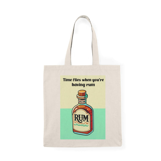 A natural-colored tote bag featuring a colorful illustration of a rum bottle with the text "Time flies when you're having rum," made from 100% recycled cotton.