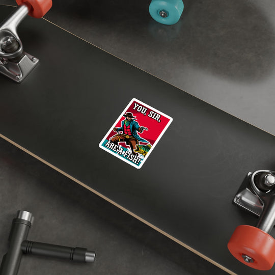 A humorous, durable sticker featuring a cowboy aiming at a fish with the bold phrase "You, Sir, Are a Fish!" shown on a laptop surface. Perfect for decorating laptops, notebooks, or any smooth surface, available as a single sticker, in packs of three, or six.