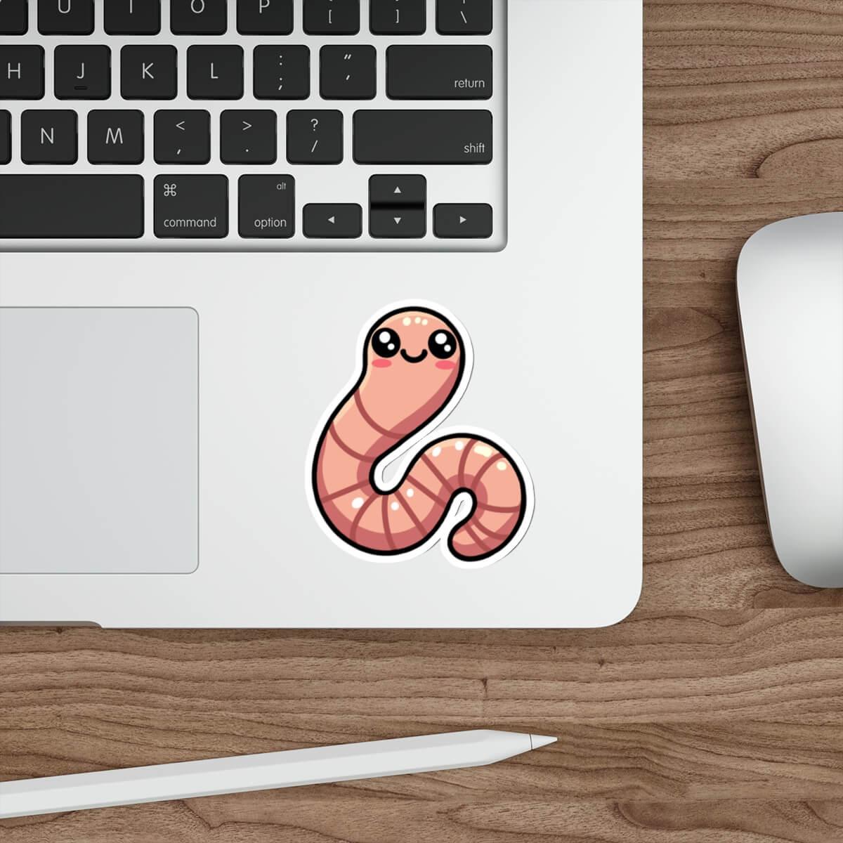 Cute pink worm sticker on a laptop keyboard, available as a single, in a three-pack, or six-pack, waterproof and durable for everyday use.