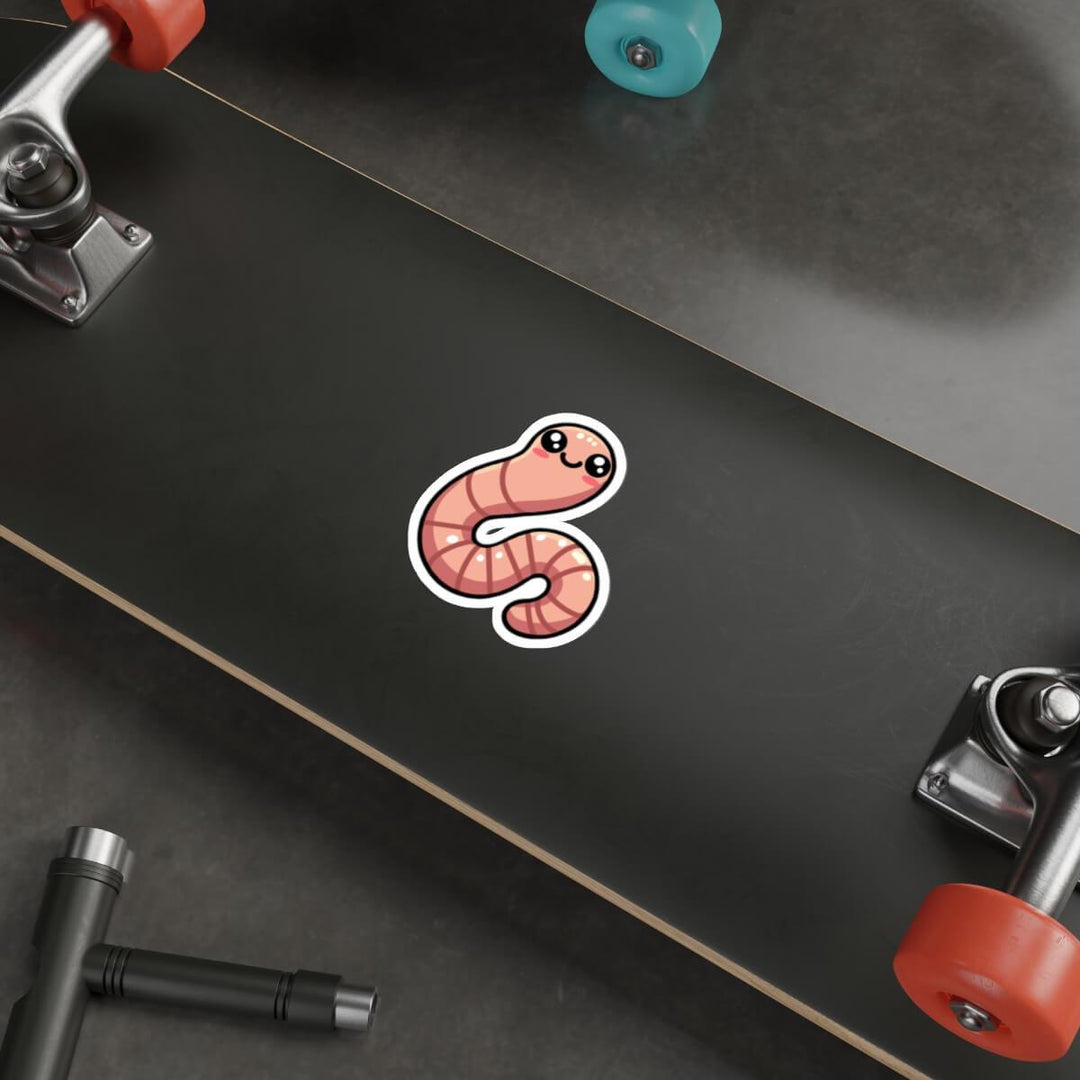 Cute pink worm sticker on a laptop keyboard, available as a single, in a three-pack, or six-pack, waterproof and durable for everyday use.