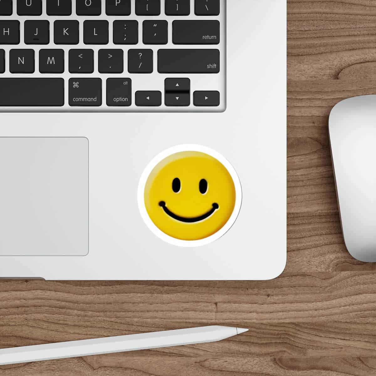Waterproof and durable smiling face sticker on a laptop keyboard, adding a touch of cheer to everyday tech accessories.