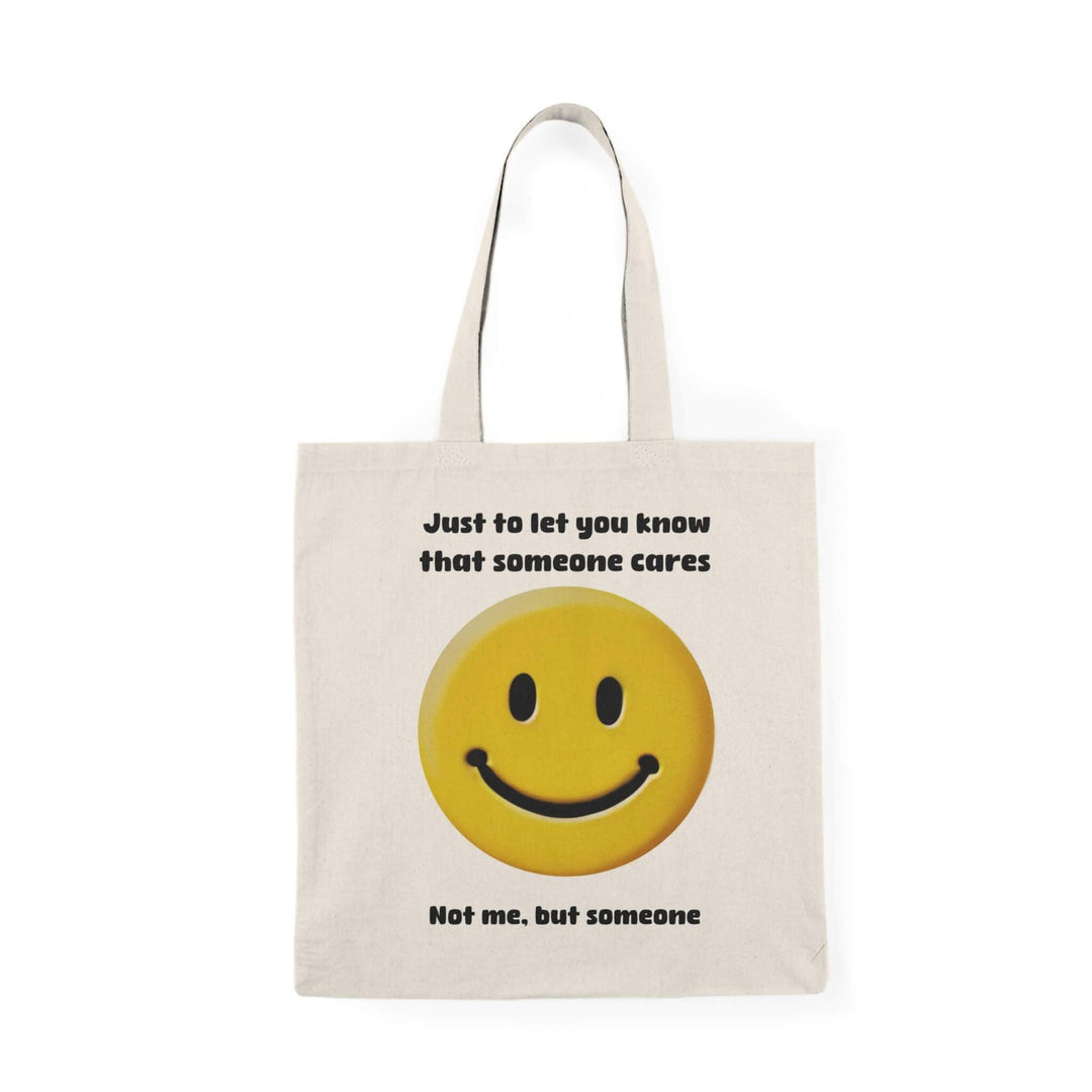 Recycled cotton tote bag with a cheeky smiley face and the humorous message, 'Just to let you know that someone cares. Not me, but someone