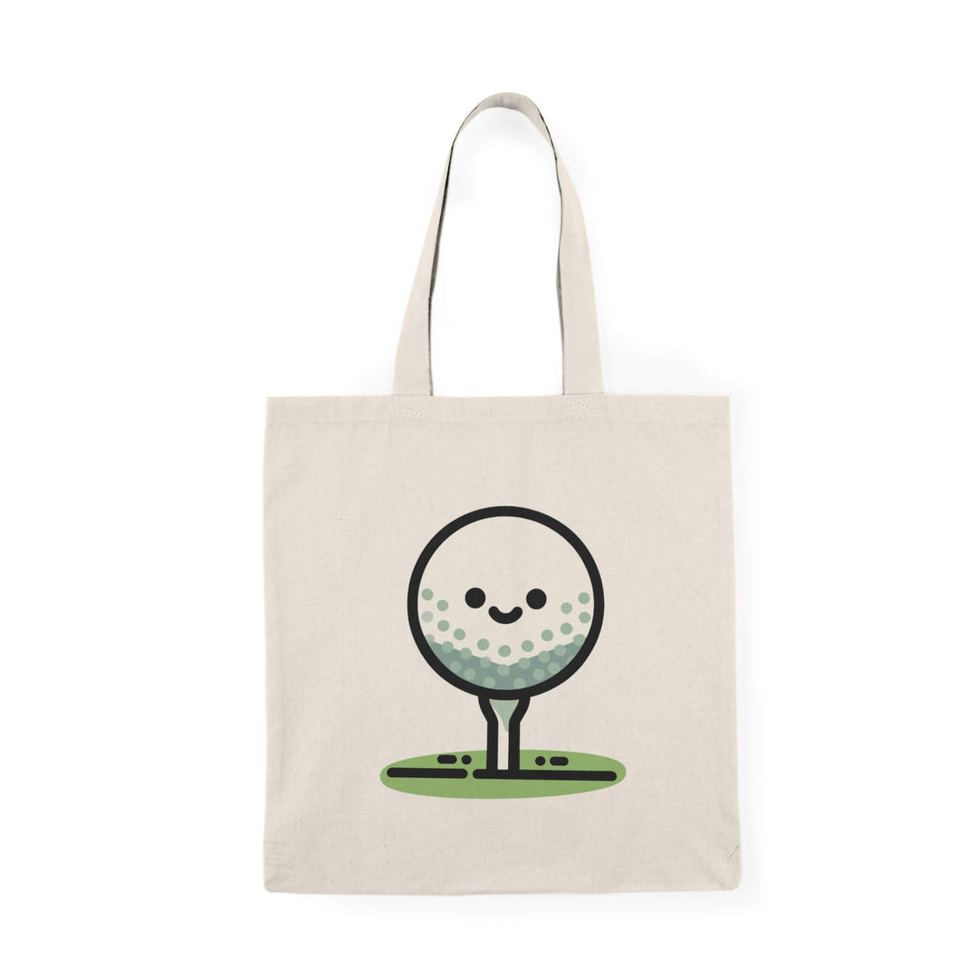 Beige cotton tote bag with a cute cartoon golf ball sitting on a tee, smiling.
