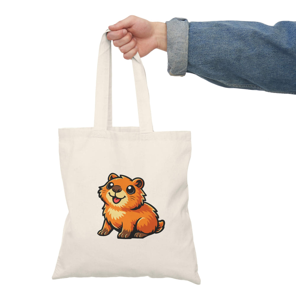 Cute capybara illustration printed on a cream canvas tote bag.