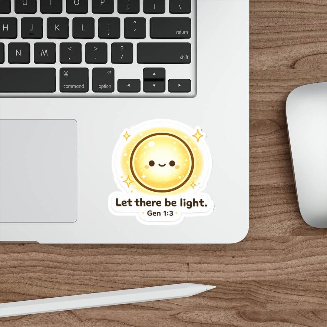 Cute smiling sun sticker with sparkles and the text “Let there be light. Gen 1:3” in kawaii style vinyl decal on a laptop.