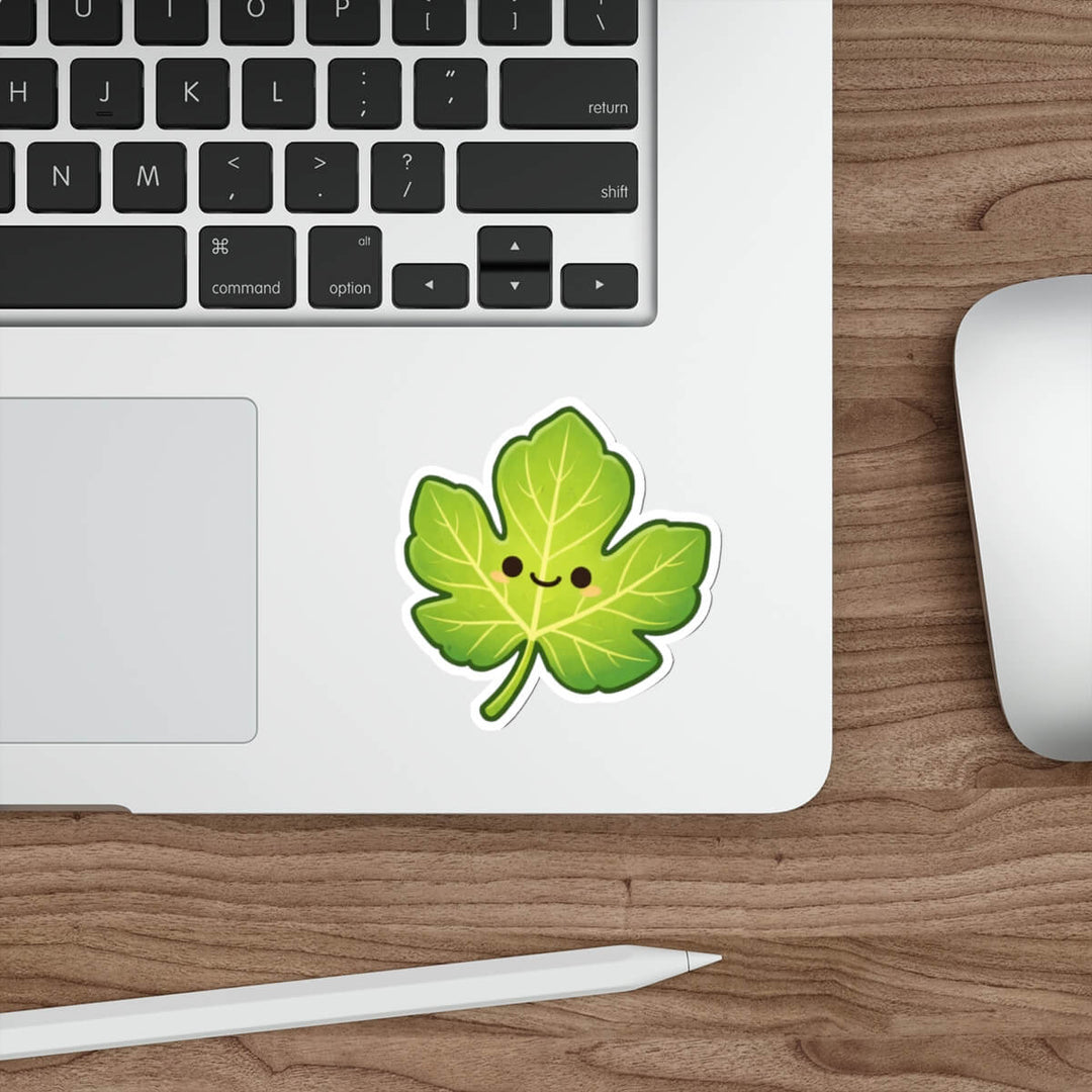 Cute green fig leaf sticker with a smiling face in kawaii style vinyl decal inspired by Genesis.