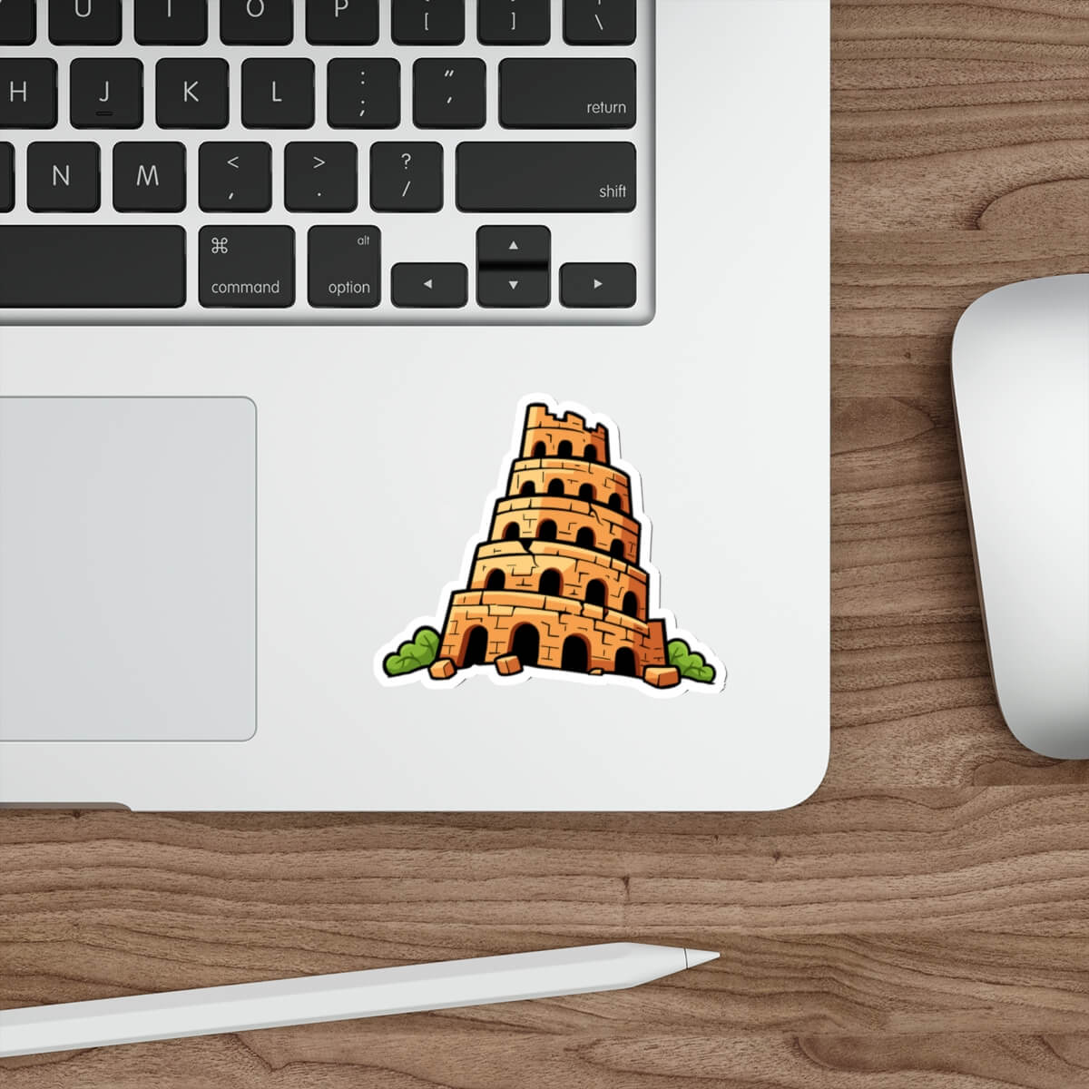 Laptop with a sticker of the Tower of Babel on a wooden desk.