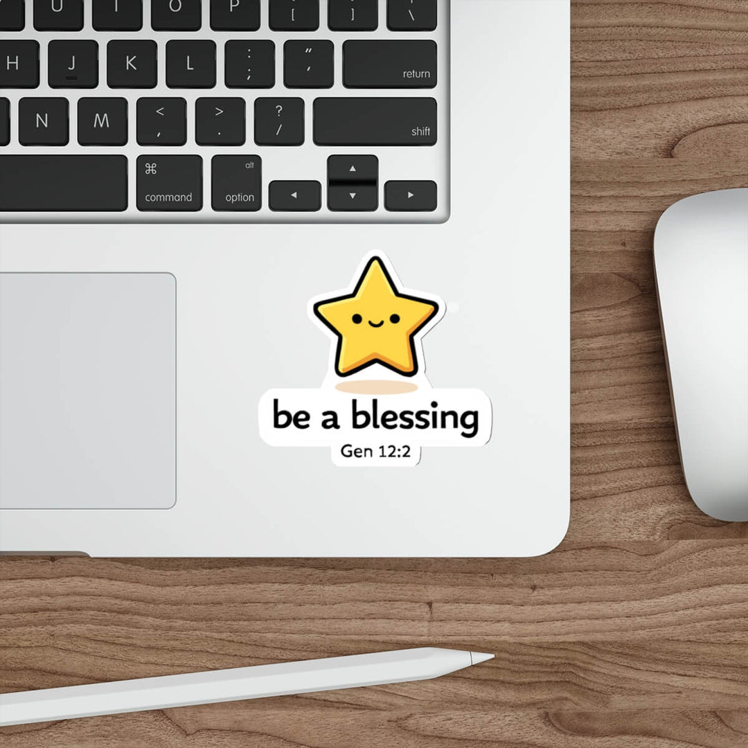 Cute smiling star sticker with the text “be a blessing Gen 12:2” in kawaii style vinyl decal on a laptop.