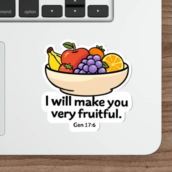 Cute fruit bowl sticker with grapes, apple, banana and orange and the text “I will make you very fruitful Gen 17:6” in kawaii style vinyl decal.
