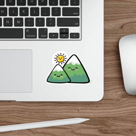 Cute mountain sticker with smiling peaks and sun in kawaii minimalist style