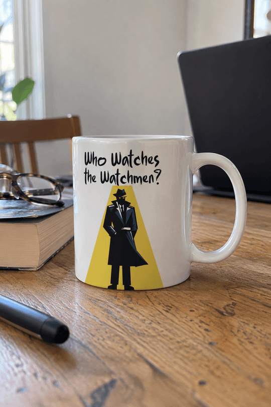 A white ceramic mug with a black and yellow graphic of a figure in a trench coat and the text &