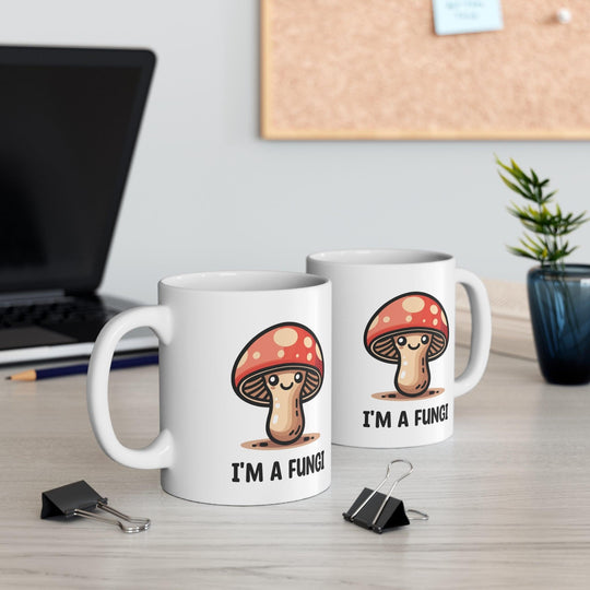 Fun ceramic mug featuring a cute mushroom character and the pun 'I'm a Fungi.' Perfect for adding a playful touch to your morning coffee, ideal for nature lovers and pun enthusiasts - Baby Keo.