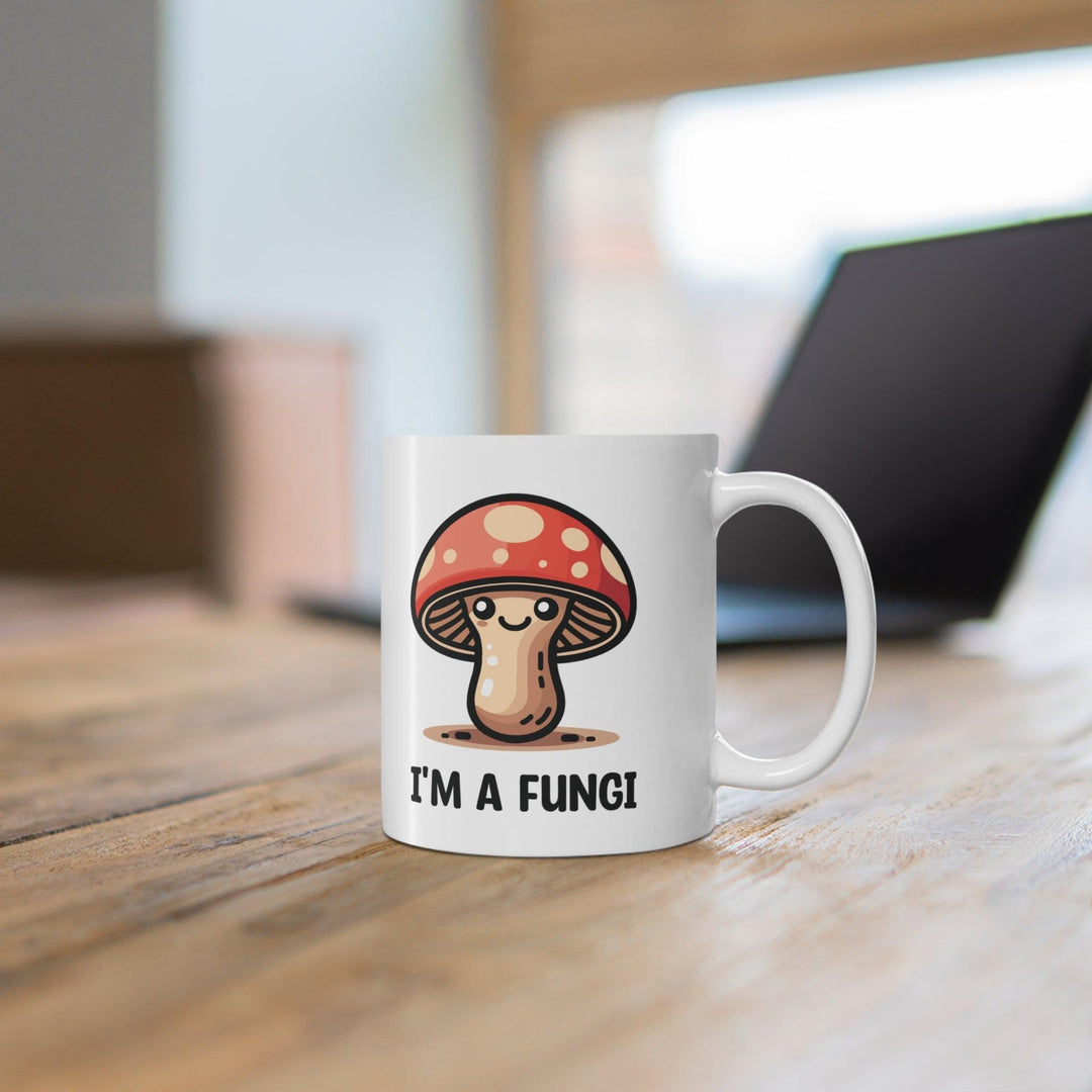 Fun ceramic mug featuring a cute mushroom character and the pun 'I'm a Fungi.' Perfect for adding a playful touch to your morning coffee, ideal for nature lovers and pun enthusiasts - Baby Keo.
