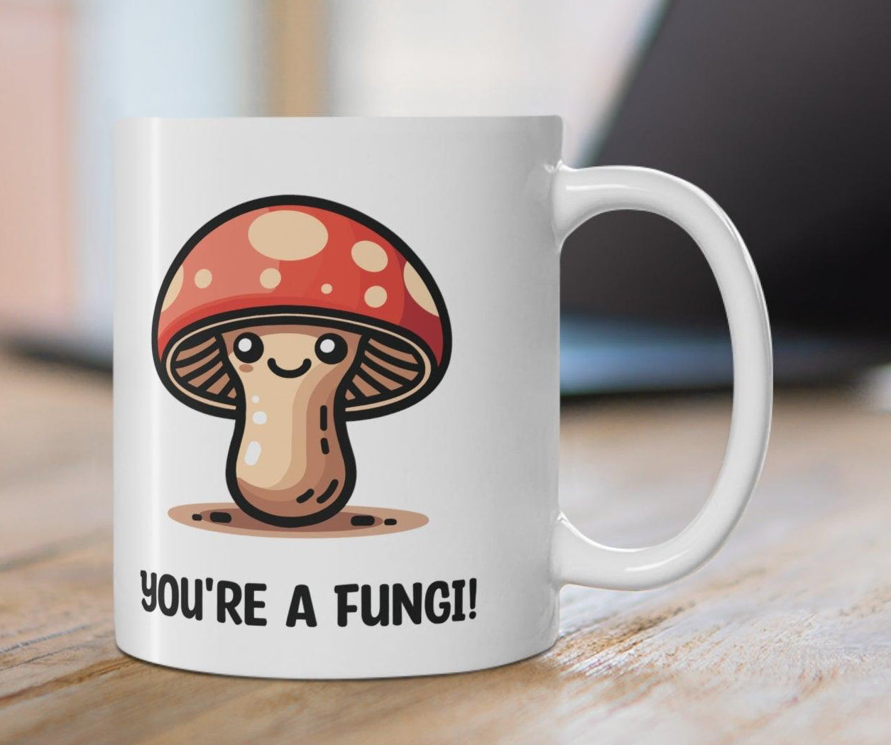 You're a Fungi' Mug - "White ceramic mug featuring a cute mushroom character and the pun 'You're a Fungi,' a great gift for lovers of puns and quirky designs."  KEOLIX