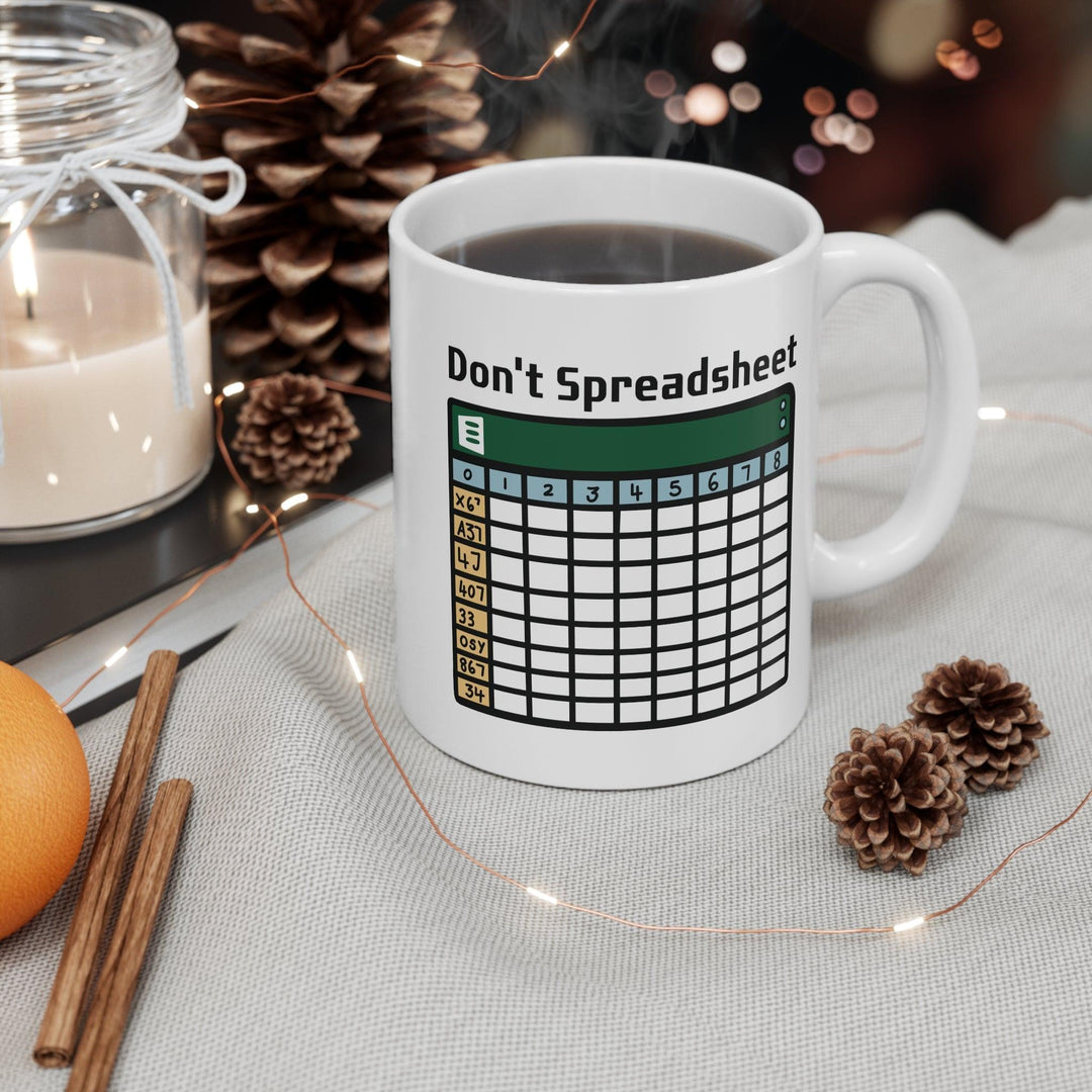 White ceramic mug with a fun design featuring a spreadsheet grid and the clever text 'Don't Spreadsheet,' perfect for office humor or a work-from-home setup