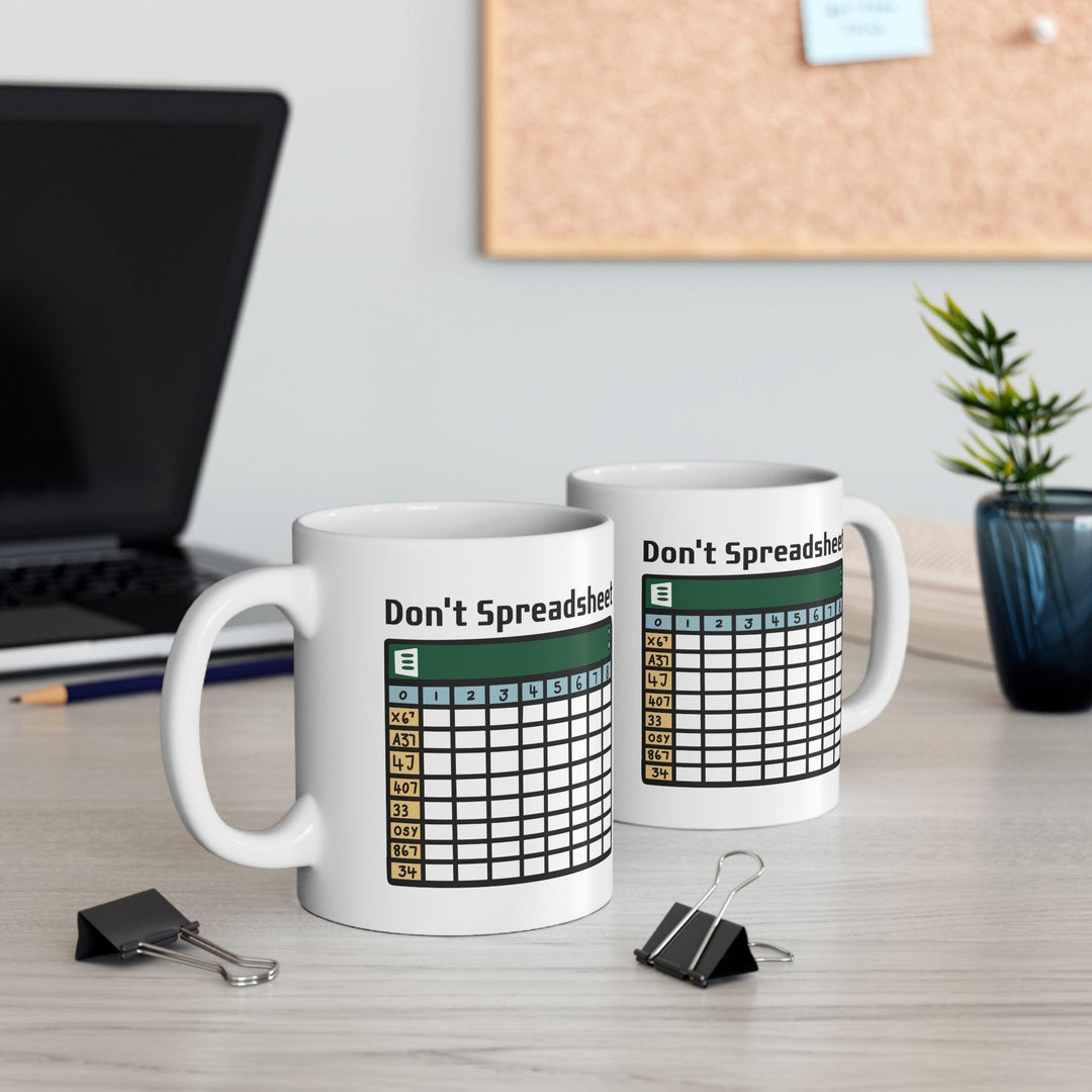 White ceramic mug with a fun design featuring a spreadsheet grid and the clever text 'Don't Spreadsheet,' perfect for office humor or a work-from-home setup