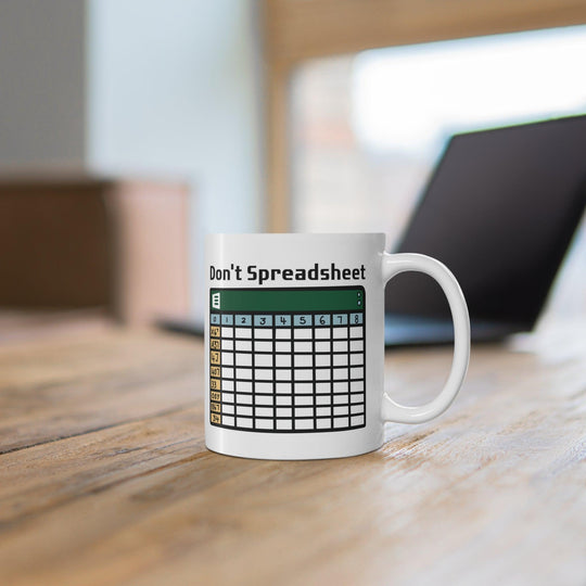 White ceramic mug with a fun design featuring a spreadsheet grid and the clever text 'Don't Spreadsheet,' perfect for office humor or a work-from-home setup