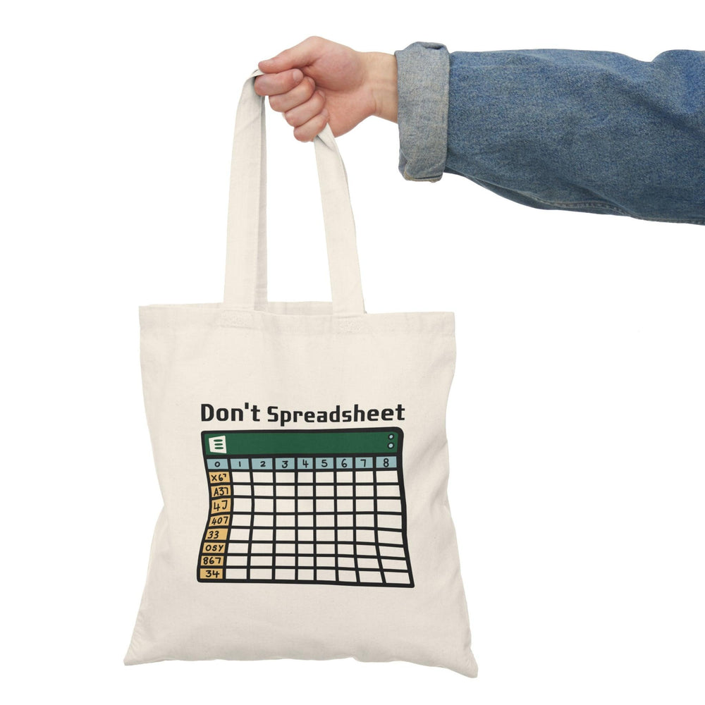 Tote bag featuring a witty design with the phrase 'Don't Spreadsheet' in bold typography. The playful graphics and bright colors create a fun accessory for anyone who loves humor and wants to express their personality while carrying essentials. Ideal for those who appreciate a light-hearted take on work culture.