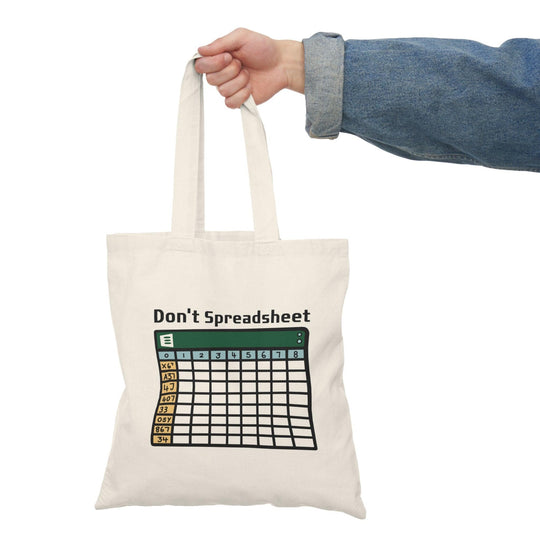 Tote bag featuring a witty design with the phrase 'Don't Spreadsheet' in bold typography. The playful graphics and bright colors create a fun accessory for anyone who loves humor and wants to express their personality while carrying essentials. Ideal for those who appreciate a light-hearted take on work culture.