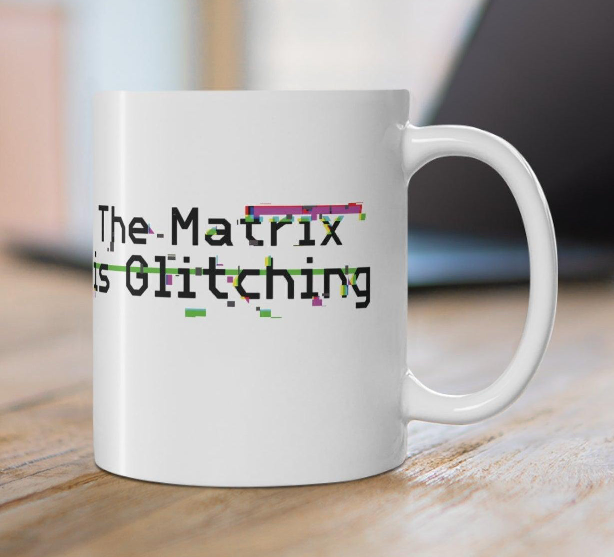 White ceramic mug featuring a retro digital font and the phrase 'The Metric Is Glitching,' ideal for lovers of tech humor.  KEOLIX