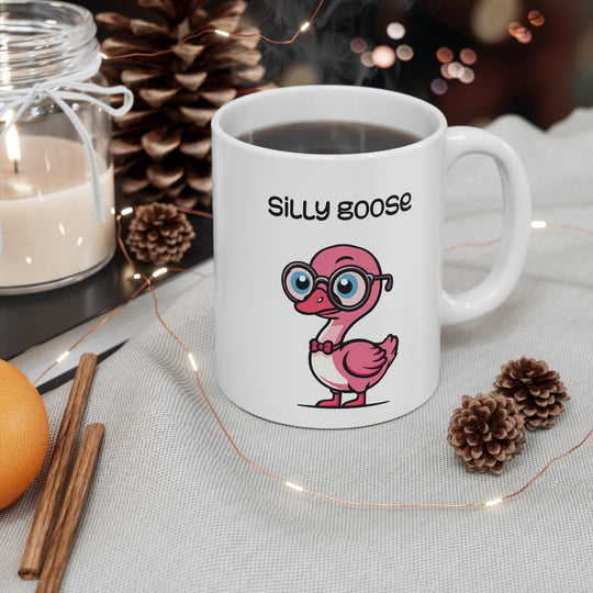 White ceramic mug with a cute and colorful cartoon goose and the phrase &