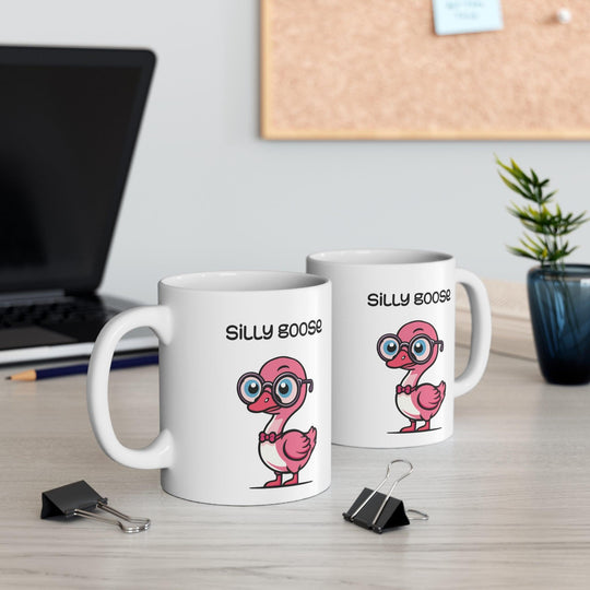 White ceramic mug with a cute and colorful cartoon goose and the phrase &