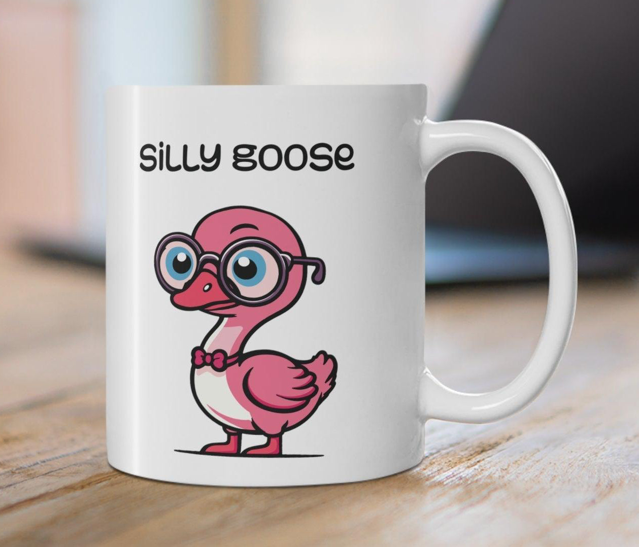 White ceramic mug with a cute and colorful cartoon goose and the phrase 'Silly Goose,' perfect for anyone with a love for playful designs.  KEOLIX